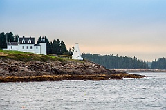 Tenants Harbor Lightouse Over Rocky Shore in Maine